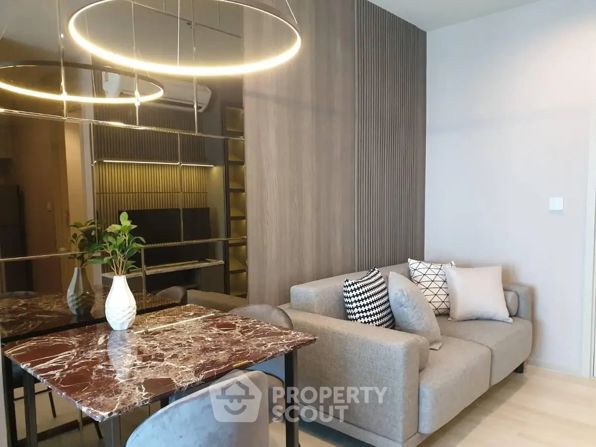 Modern living room with stylish decor and elegant lighting