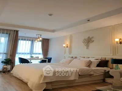 Luxurious bedroom with elegant decor and natural light