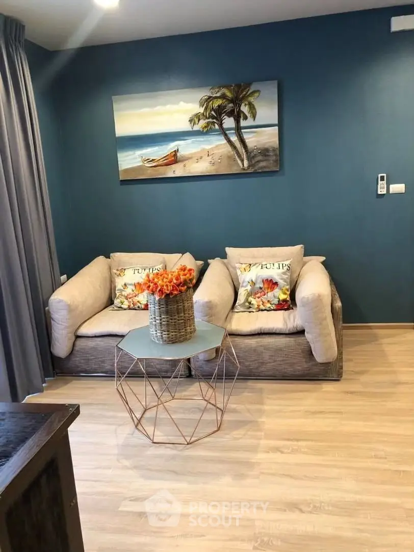 Chic living room with modern decor and vibrant artwork, perfect for relaxation and style.