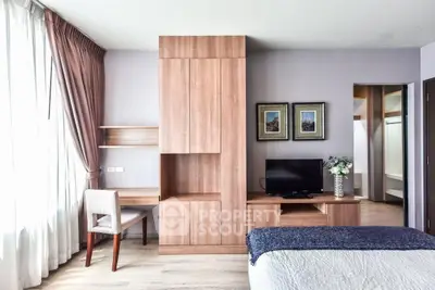 Modern bedroom with stylish wooden furniture and natural light