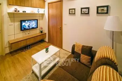 Cozy living room with modern decor and wall-mounted TV