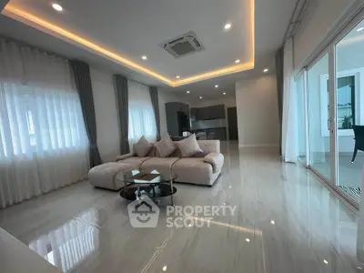 Luxurious modern living room with elegant lighting and spacious open layout