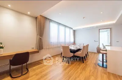 Spacious dining area with elegant decor and natural light, perfect for entertaining guests.