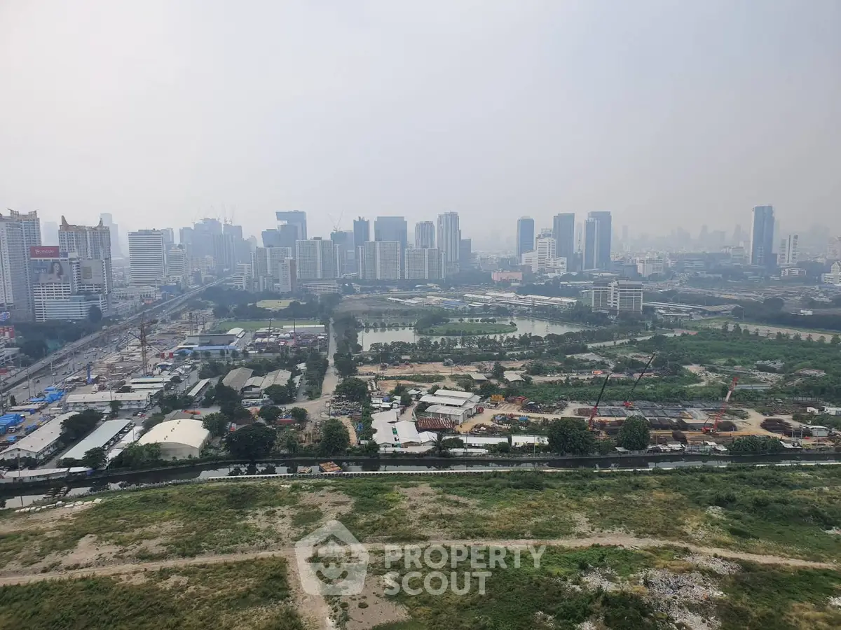 Stunning cityscape view showcasing urban skyline and green spaces, ideal for real estate investment opportunities.