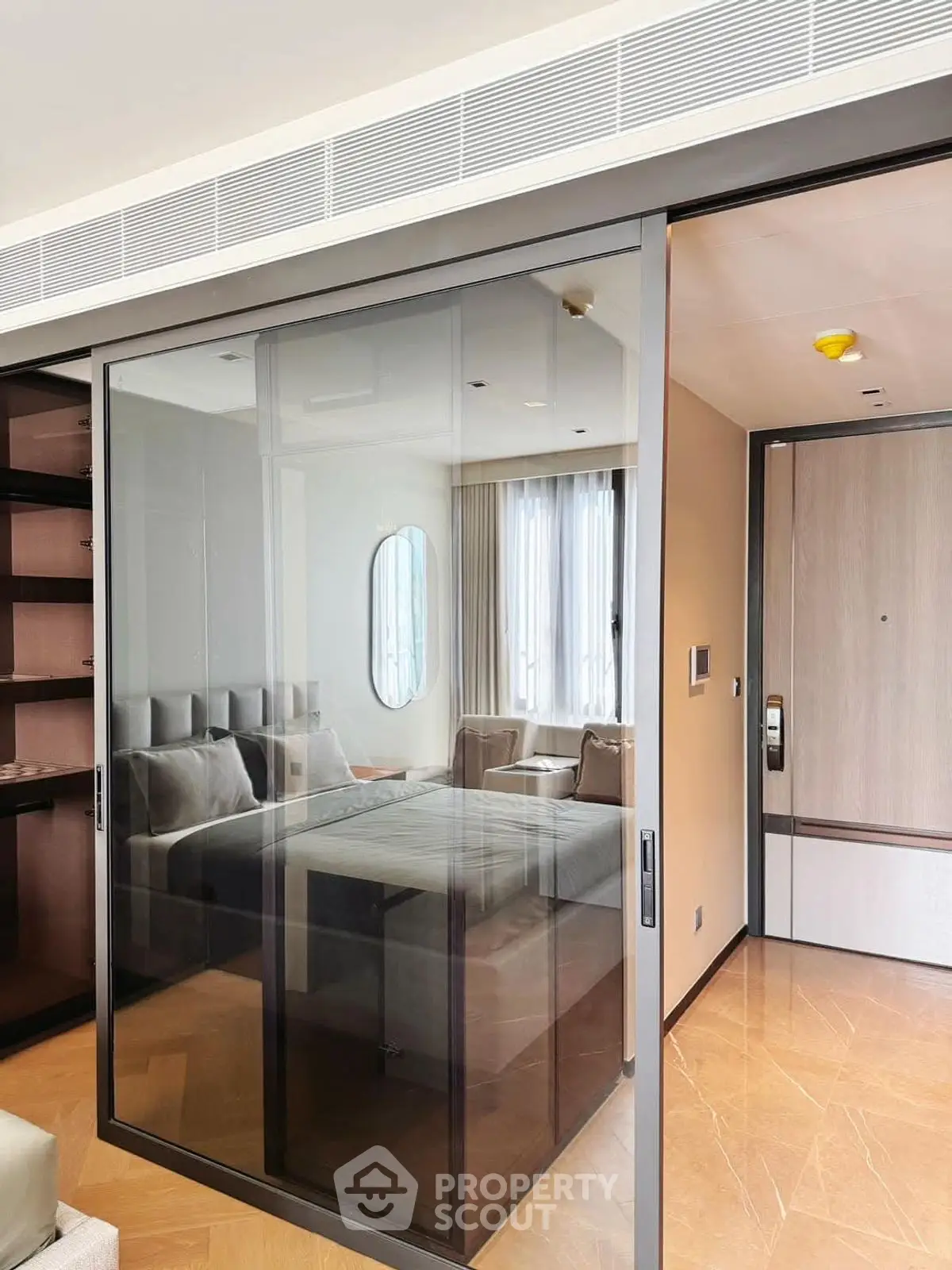 Modern living room with glass sliding doors and stylish furnishings