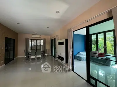 Spacious modern living room with dining area and garden view