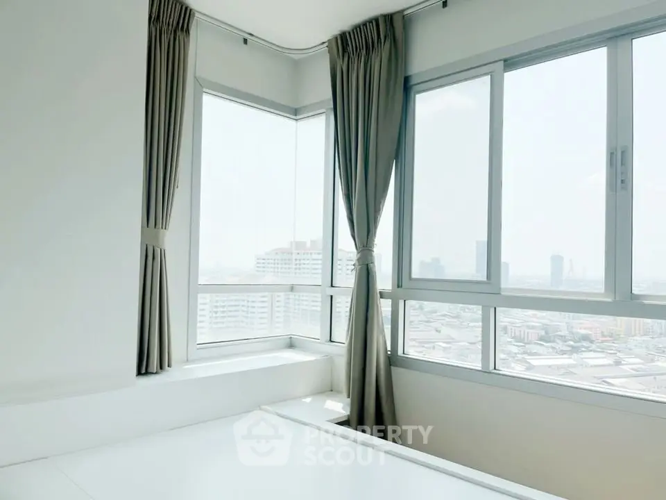 Bright corner unit with large windows offering stunning city views, perfect for modern living.