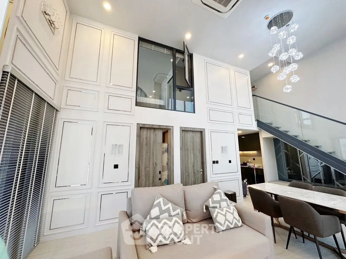 Luxurious modern living room with high ceilings and elegant decor