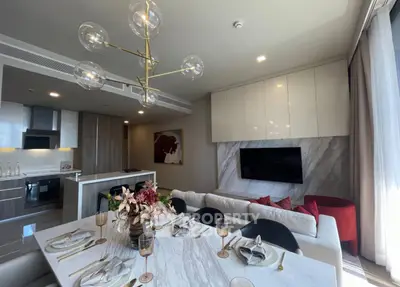 Luxurious open-plan living room with modern kitchen and elegant dining area