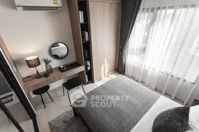 Modern bedroom with stylish decor, featuring a cozy bed, elegant desk, and large window for natural light.