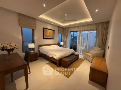 Luxurious bedroom with modern decor, featuring a cozy bed, elegant lighting, and large windows with scenic views.