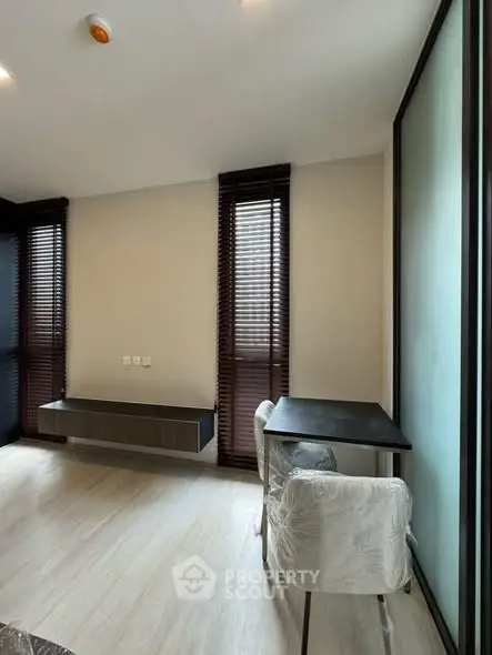 Modern study room with sleek furniture and natural light, perfect for productivity and comfort.