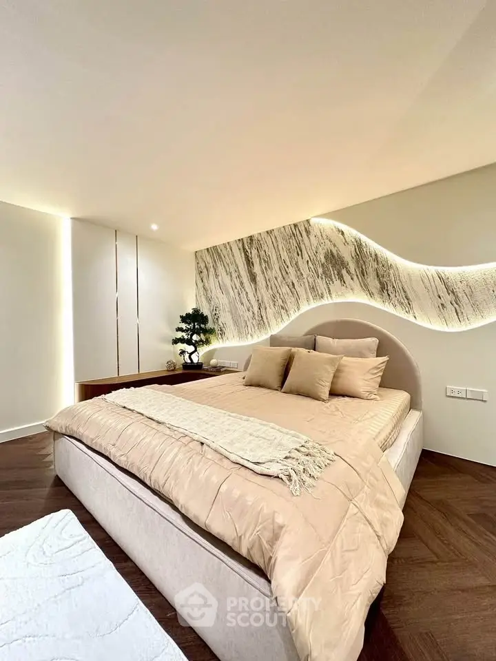 Luxurious modern bedroom with elegant lighting and stylish decor