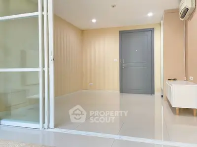 Spacious modern living room with sleek design and ample natural light