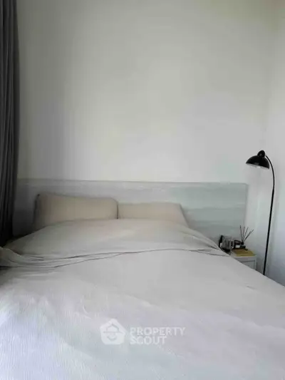 Cozy bedroom with modern decor and soft lighting