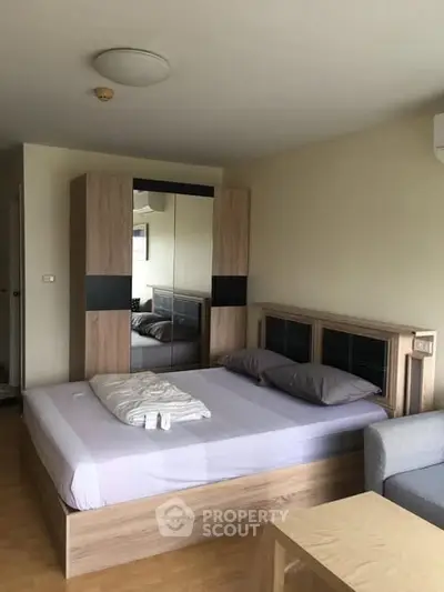 Modern bedroom with wooden furniture and cozy ambiance