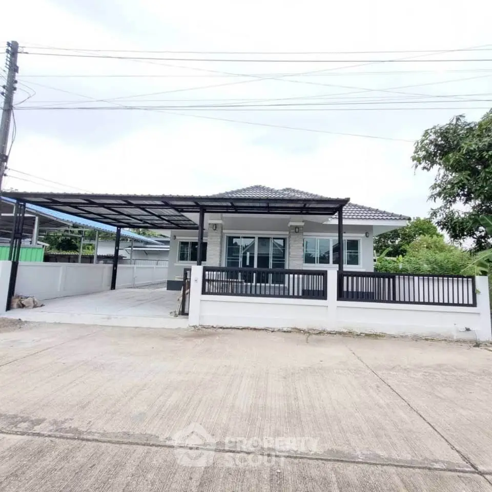 Charming single-story house with modern design and spacious driveway, perfect for family living.