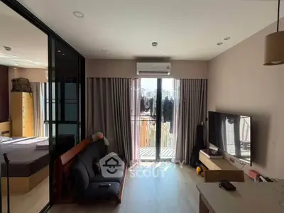 Modern living room with balcony access and sleek interior design