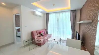 Modern living room with stylish decor and natural light in a contemporary apartment.