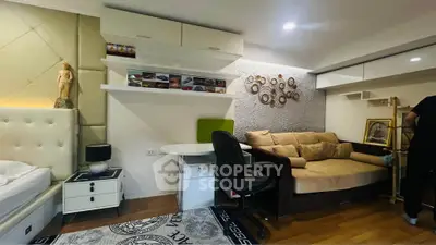 Modern living room with stylish decor and cozy seating area, perfect for relaxation and entertainment.