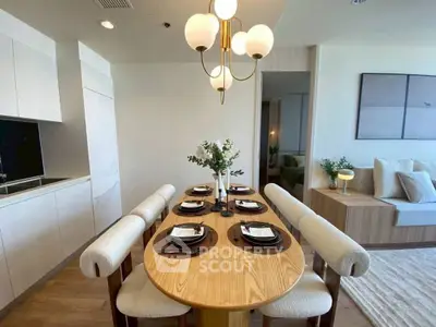 Modern dining area with elegant lighting and stylish decor in a contemporary apartment.