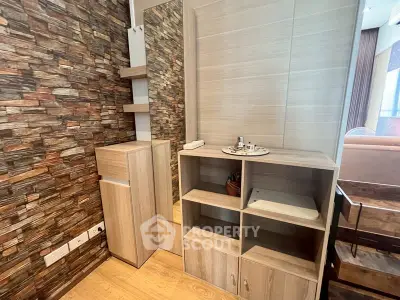 Modern living room corner with stylish wooden shelves and stone accent wall