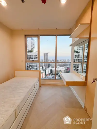 Modern bedroom with stunning city view and built-in desk