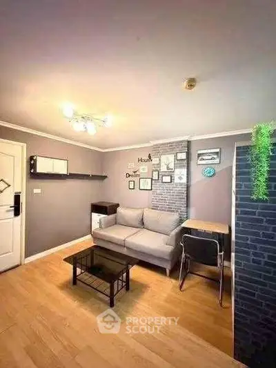 Cozy living room with modern decor and comfortable seating in a stylish apartment.