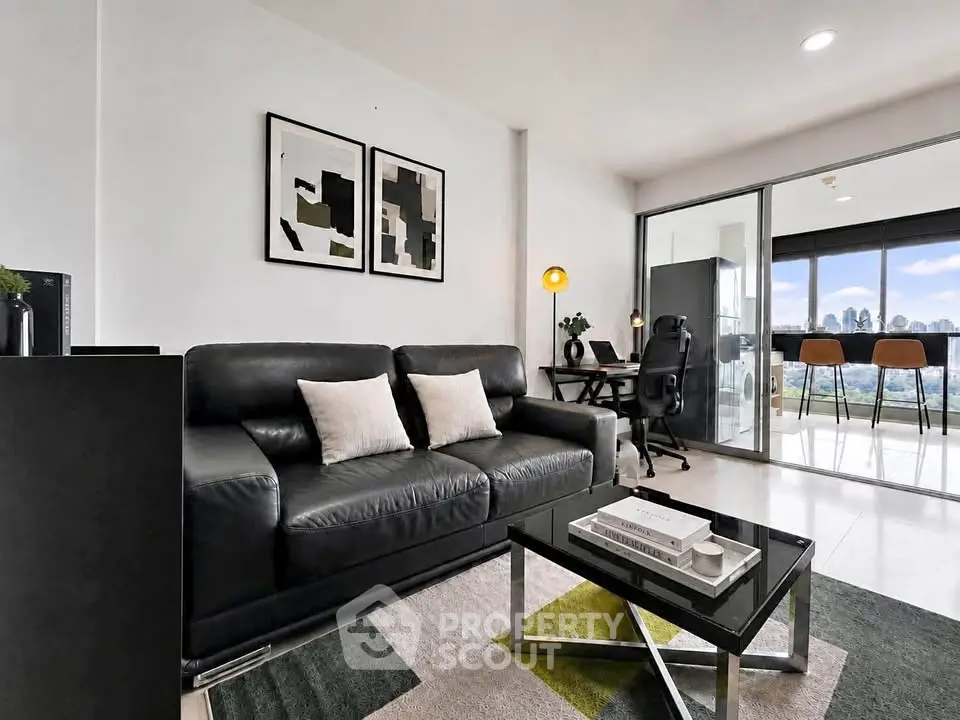 Modern living room with sleek black sofa and city view, perfect for urban living.