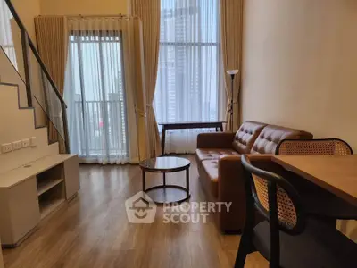 Modern living room with high ceilings and city view, featuring stylish furniture and natural light.