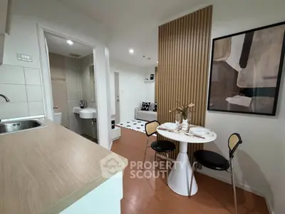 Modern open-plan living space with stylish dining area and cozy seating, perfect for urban living.