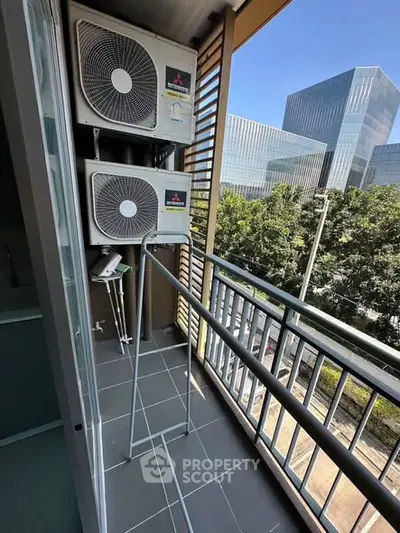 Modern balcony with air conditioning units and city view, perfect for urban living.