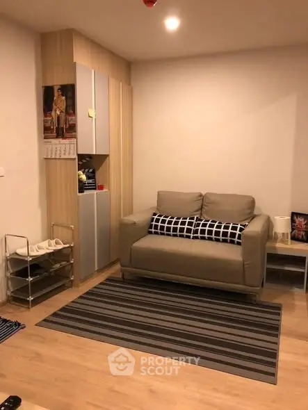 Cozy living room with modern decor and striped rug