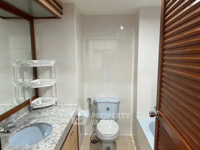 Spacious bathroom with modern fixtures and elegant marble countertop