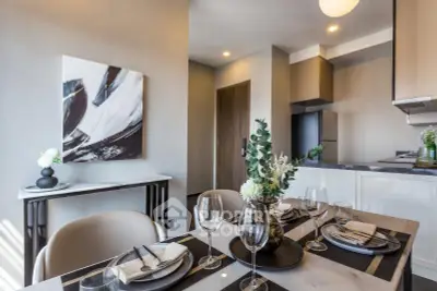 Modern dining area with elegant table setting and stylish kitchen in open layout apartment.