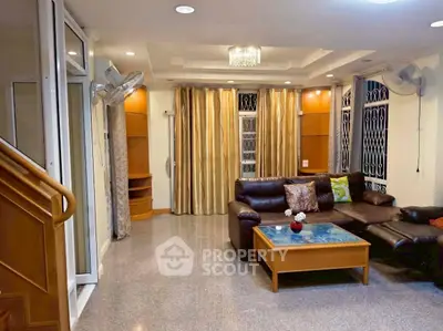 Spacious living room with modern furniture and elegant lighting