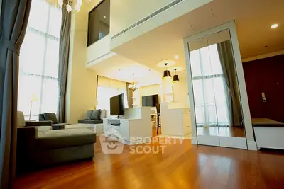 Spacious modern living room with high ceilings and elegant decor