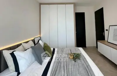 Modern bedroom with stylish decor and ample storage space