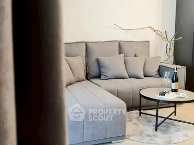 Stylish modern living room with cozy gray sectional sofa and chic decor
