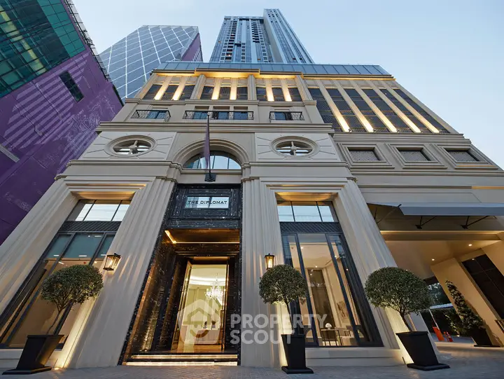 Luxurious high-rise building entrance with elegant architectural design and modern facade.