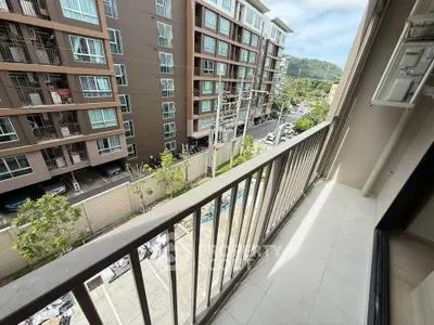 Spacious balcony with scenic view in modern apartment complex