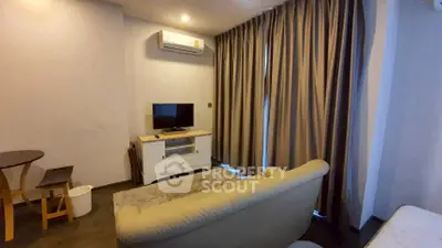 Cozy living room with modern air conditioning and stylish curtains