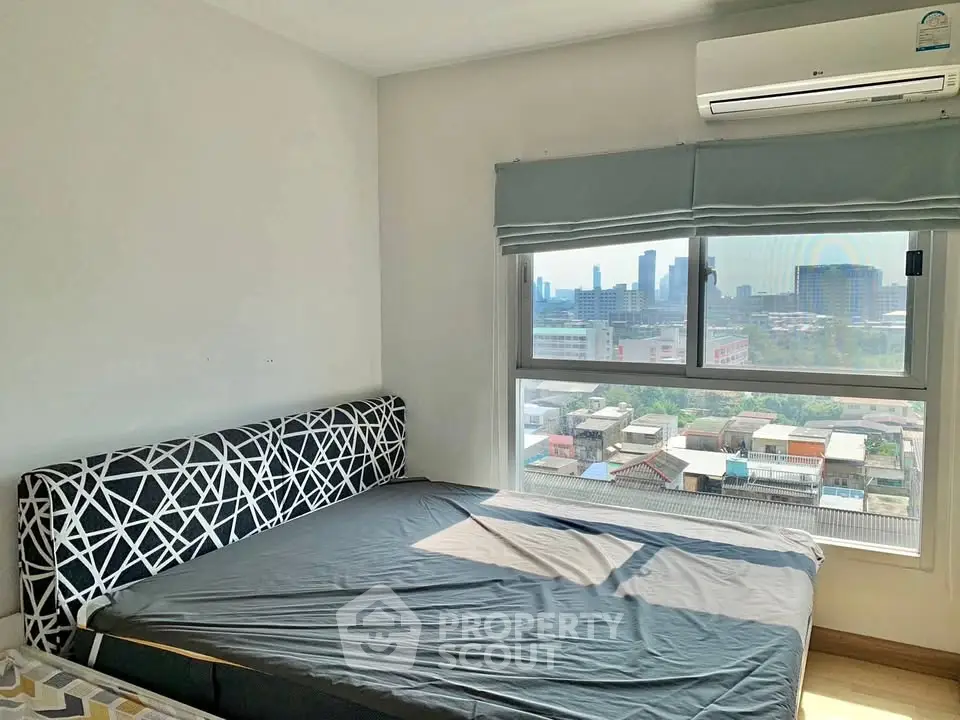 Bright bedroom with city view and modern decor in urban apartment