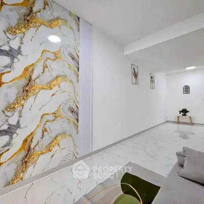 Elegant modern living room with marble accent wall and minimalist decor