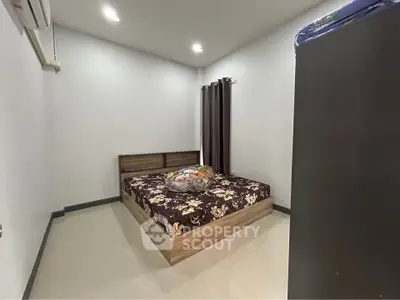 Cozy bedroom with modern decor and plush bedding in a serene setting.