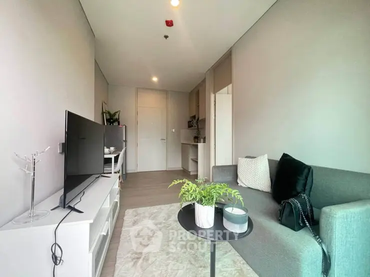 Modern living room with sleek furniture and stylish decor in a contemporary apartment.