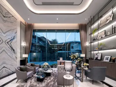 Luxurious modern living room with elegant decor and large window view.