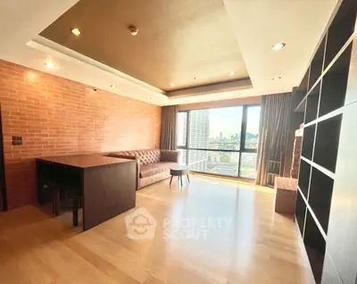 Spacious modern living room with city view and stylish brick wall design