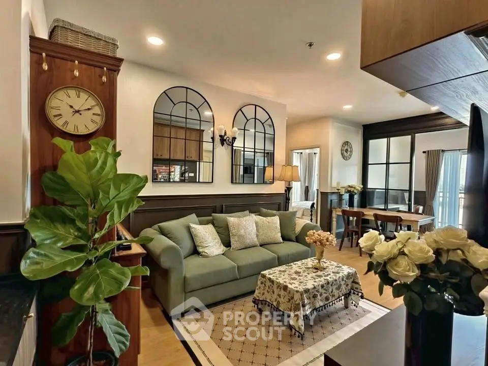 Charming living room with elegant decor and cozy seating area, perfect for relaxation and entertaining.