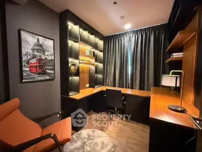 Stylish home office with modern desk, shelving, and cozy seating area.